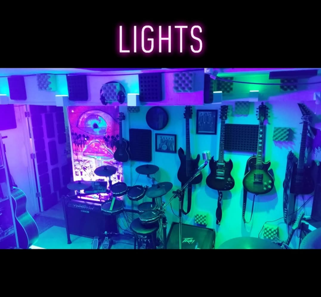 Lit-up DJ mixer with colorful studio lights